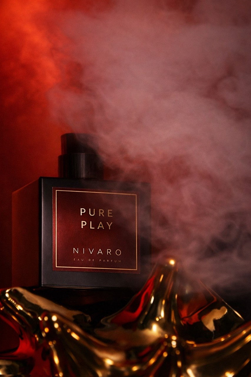 Nivaro Pure Play perfume bottle with smoke effect on a dark background